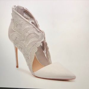 Statin and fabric pointed toe pumps.